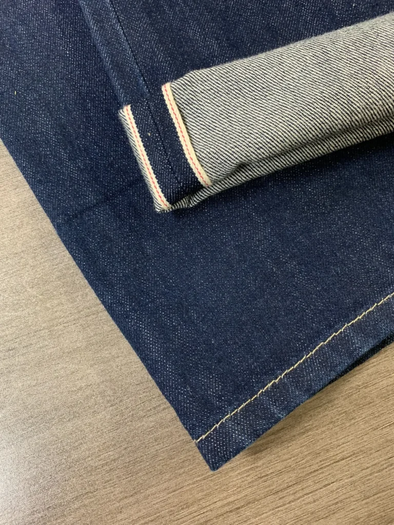 Close-up photo of HB24905 selvedge denim cuff, showing the woven selvedge edge detail